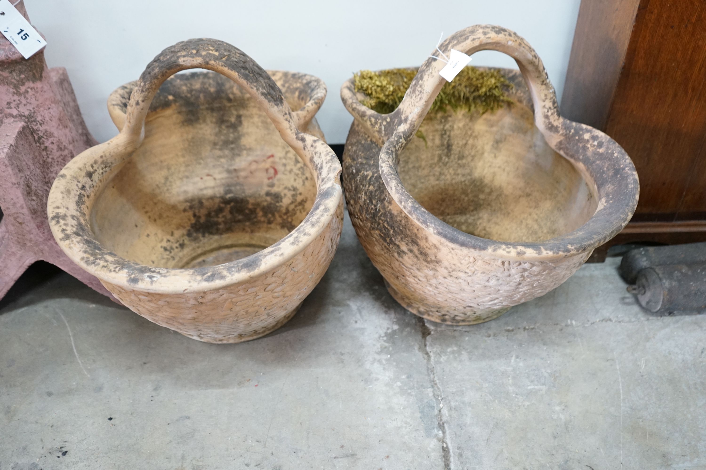A pair of French terracotta basket garden planters, width 34cm, length 52cm, height 42cm